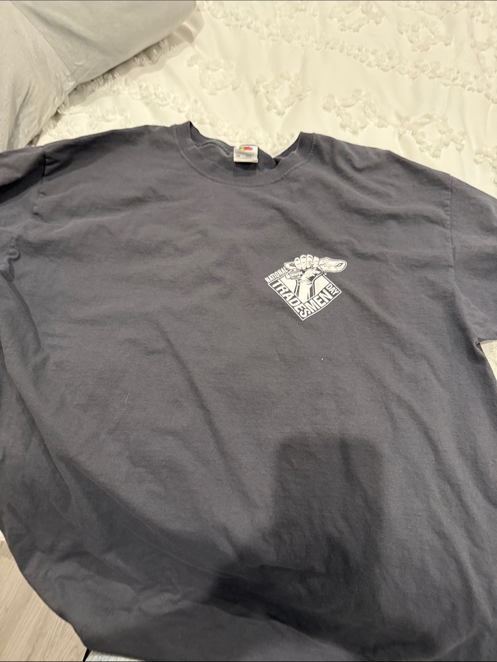 Men’s grey short sleeve tee shirt with imprints of National Tradesmen Day